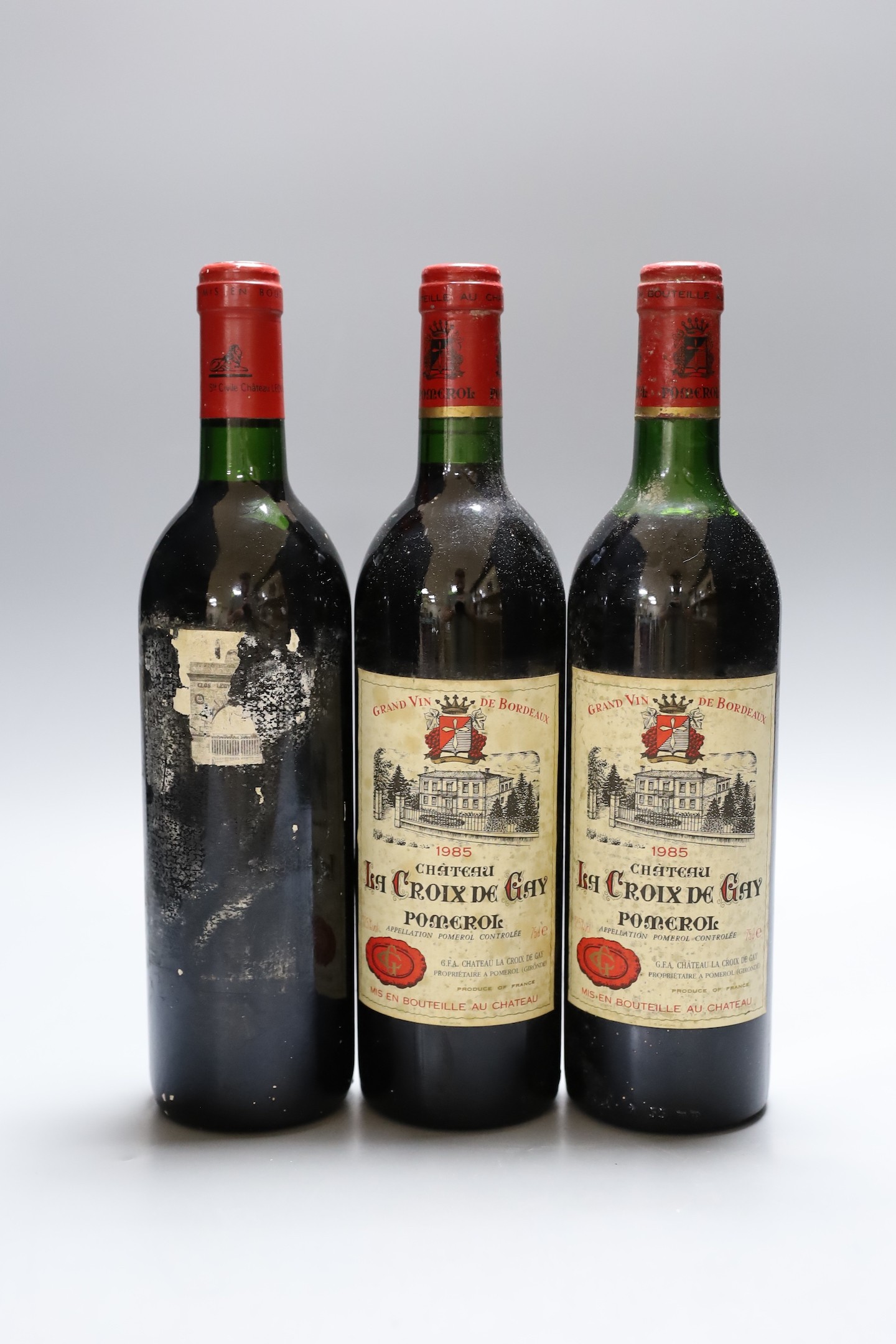 A bottle of Leoville Las Cases (undated) and two bottles of 1985 Château Isla Croix de Gay, pomerol